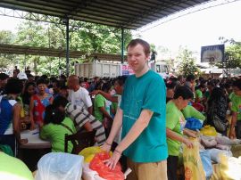 Distributing relief goods at a survivor collective after Typhoon Washi (Photo: BALSA Mindanao)